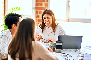 a group of people at a meeting focusing on growing their business