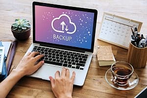 a laptop with backup on it showing data backup is important in managed it services