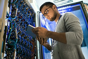 an it professional working in a server room as a part of outsourced it support services