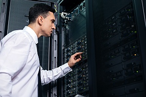 an it professional working on a server as a part of managed it services