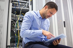 it professional performing preventative maintenence on a business server