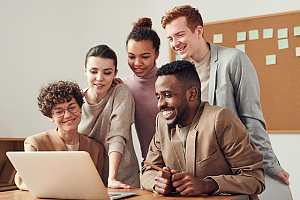 Positive IT consultant team at desk