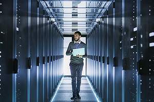 IT Technician Working in a data and IT systems.Remote data backup can be structured as either onsite or offsite