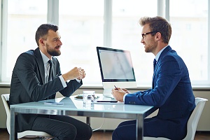 IT consultant speaking with a client in a meeting about the best IT strategies for them in fairfax va