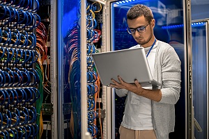 database consultant inside of a large server room helping a business