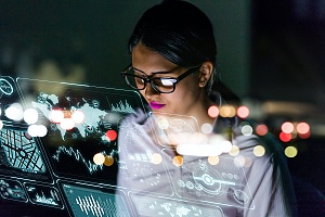 it consultant in rockville md using her laptop to solve a client problem at night