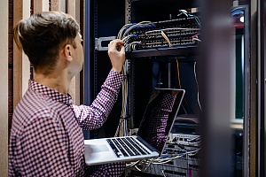 it consulting professional in a server room in maryland fixing an issue