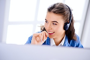 virtual IT help desk worker speaking into a headset