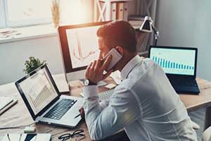 Man on phone with his managed IT services provider