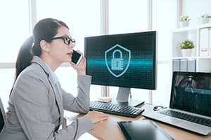 woman on phone with cybersecurity consulting