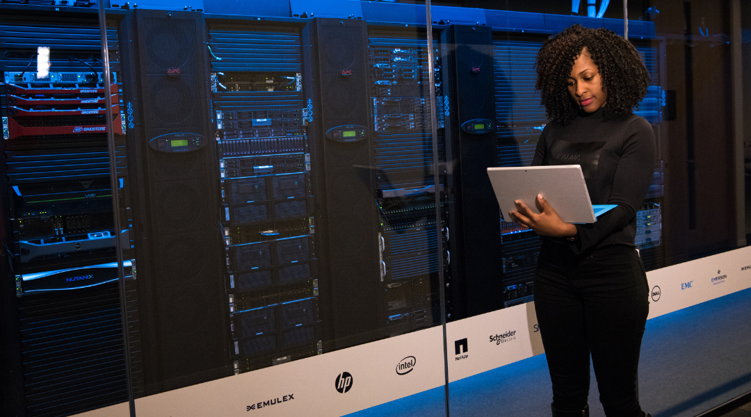 A technician applying system updates or setting up secure remote access, an example of IT best practices